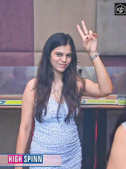 A peace sign from a happy partygoer enjoying the Sunday night session.