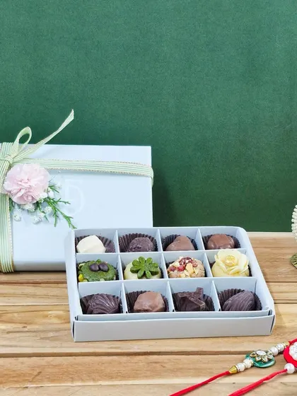 A closer look at the mixed 12-piece Rakhi box, showing the different shapes and textures of my handmade chocolates and mithai.