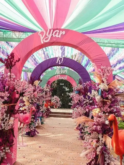 Make a grand statement from the very first step. This vibrant, multi-colored arched entryway was designed for a fun-filled Haldi ceremony, setting a joyful and festive tone for the event.