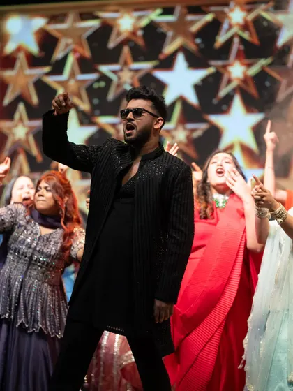 The groom leading his group performance with full rockstar energy. The crowd's reaction says it all.
