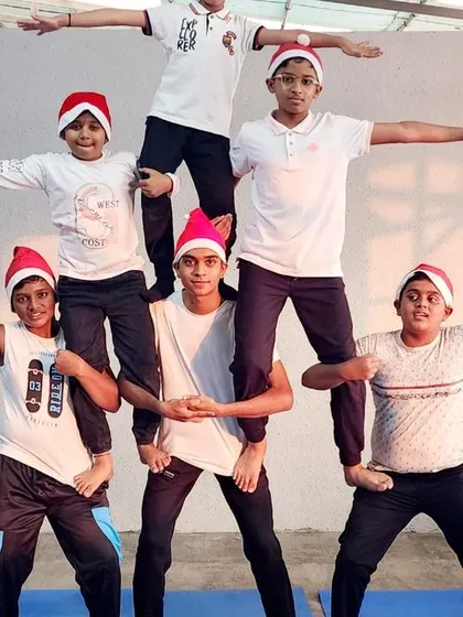 Spreading our wings for the holidays. This festive group pose is full of joy and Christmas spirit, reflecting the happy atmosphere of our camp.