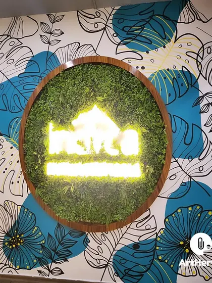 We combined a doodle art background with a 3D moss art installation and a neon logo for this unique office piece in Delhi. This multi-media approach creates a textured and eye-catching result.