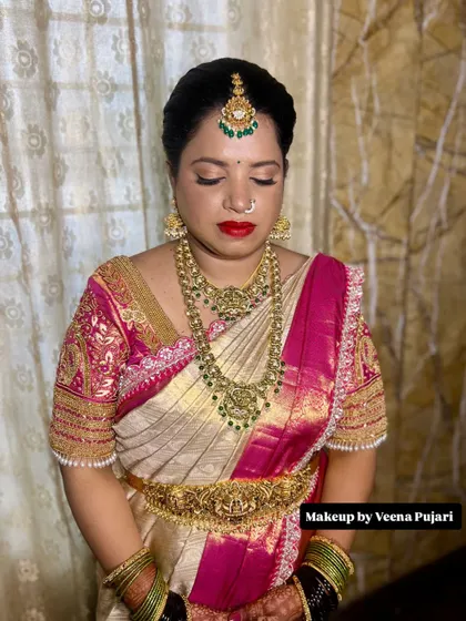 A serene moment captured. The soft-focus eyeshadow and perfectly blended base makeup give this bride a divine and peaceful aura.