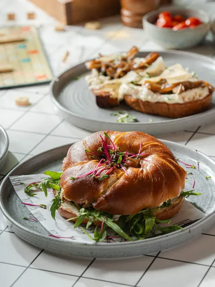 A breakfast spread featuring our popular lye bagel sandwich. We're serving up fresh and delicious breakfast options at six of our locations now.