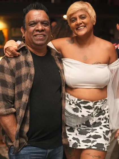 Posing with a stylish friend at our midweek party.
