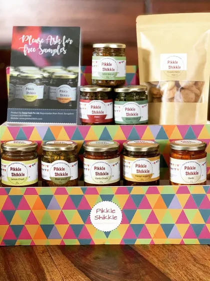 We have a little something for everyone. This display shows some of our most loved pickles, jams, and mathri, all ready for you to take home. We believe in variety and authentic Punjabi taste.