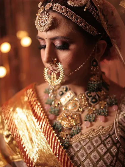 A detailed shot of the crescent-shaped nath and the heavy choker.