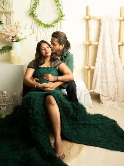 A romantic kiss on the cheek. This pose is perfect for capturing the love and affection between expecting parents.