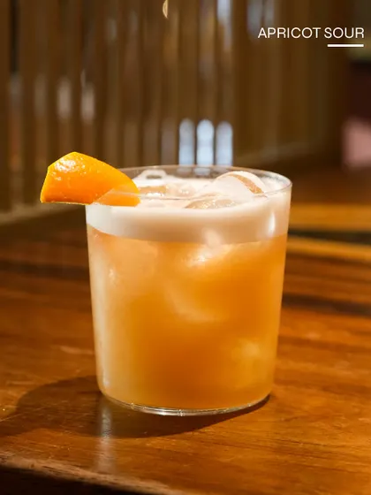 The Apricot Sour, a fruity and frothy sour with the sweetness of apricot.