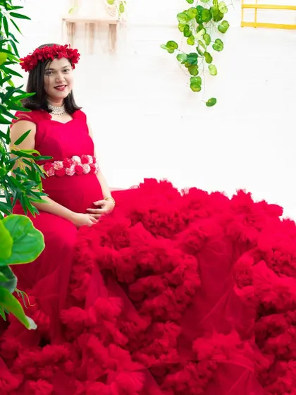 A beautiful result from one of our maternity photography packages. This client is in our red ruffle gown in our indoor studio.