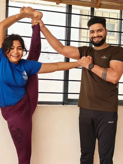 A joyful moment of achievement. I'm here to support my students as they reach new heights in their practice, like this beautiful standing split.
