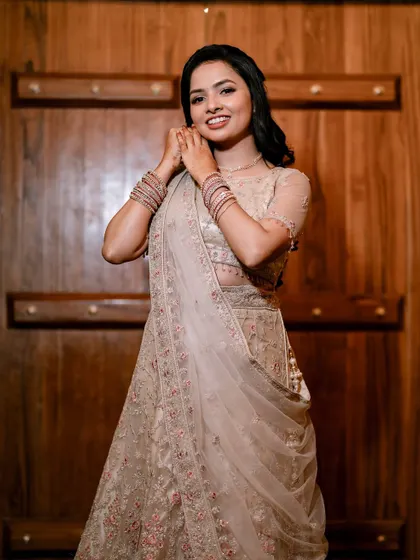 A lovely portrait of the bride-to-be. The soft makeup and hair perfectly complement her delicate lehenga.