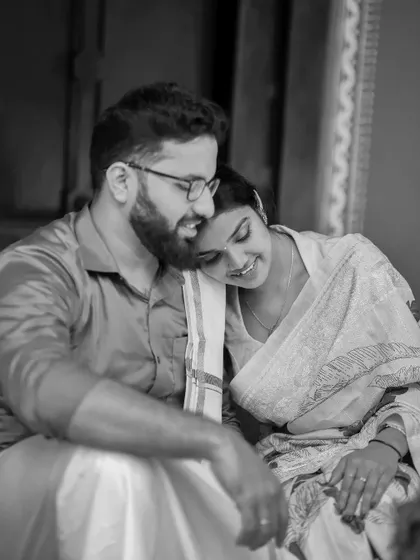 A timeless black and white photo of a couple sharing a quiet, intimate moment during their pre-wedding session.