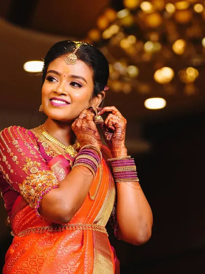 A candid moment of the client on her engagement day, her smile lighting up the room.