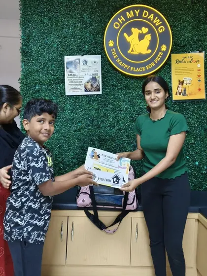 Another happy adopter receiving their certificate. This simple piece of paper represents a new beginning and a life saved.