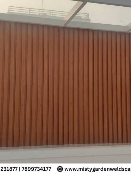 A full view of the WPC louver wall, showcasing its clean vertical lines and rich wood-like texture.