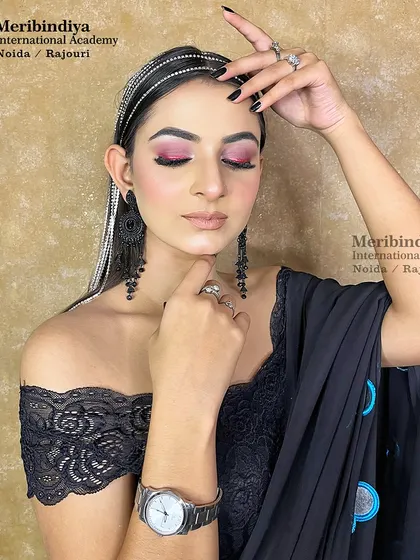 A chic and edgy party look, with hair styled straight and accessorized with a rhinestone headband and long, dangling hair chains.