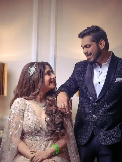 A happy and interactive portrait of the engaged couple, sharing a smile.