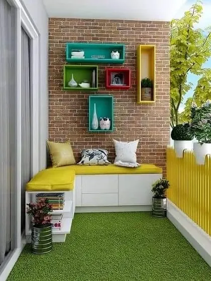 This balcony features a smart, space-saving L-shaped bench with built-in storage underneath. The bright yellow cushion adds a pop of color, while the artificial grass flooring makes the space feel playful and comfortable.