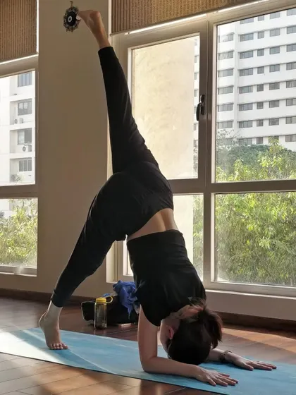 Reversing gravity's effect on circulation with this variation of a standing split. Inversions energize the body and calm the mind.