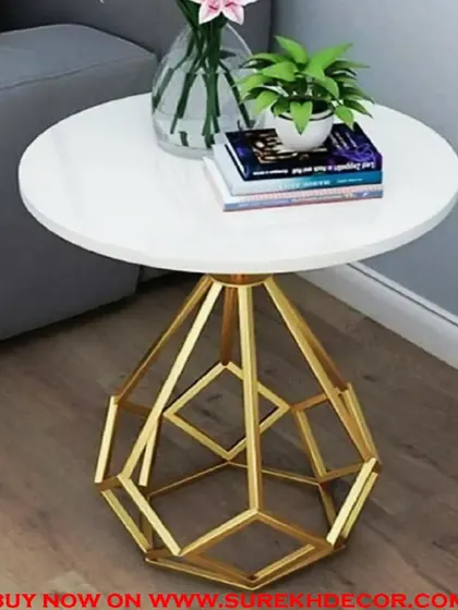 This side table features a white marble top and a unique, diamond-shaped geometric base with a gold electroplated finish. It's a true statement piece that combines artistic design with practical function.