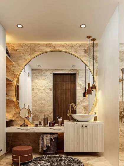 A luxurious bathroom vanity area that feels like a private spa. The large, backlit round mirror is set against a marble wall, with a vessel sink and elegant pendant lights completing the high-end look.