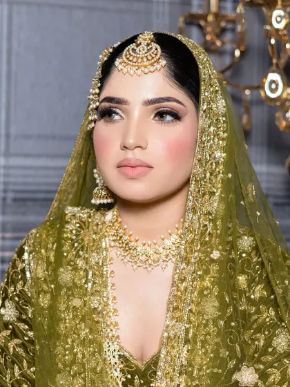 A side profile of this gorgeous bridal look, showing the seamless blending and the beautiful shimmer on the eyelids.