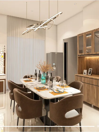 This view shows how the dining area, pooja unit, and crockery cabinet come together in our 'Majestic Fortune' project. The design ensures a harmonious flow between different functional zones.