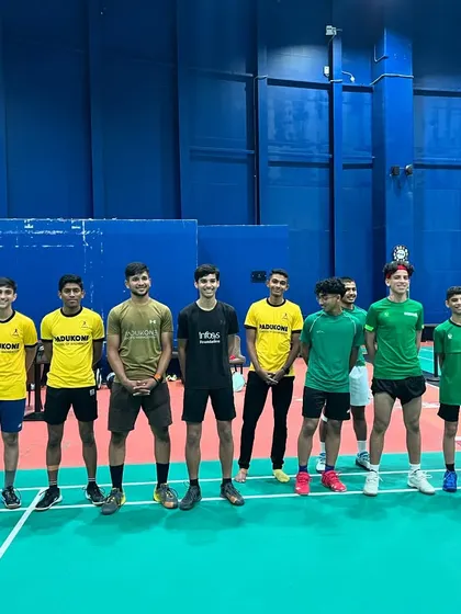 A group of our players posing with athletes from the Saudi Badminton Federation during a joint training camp.