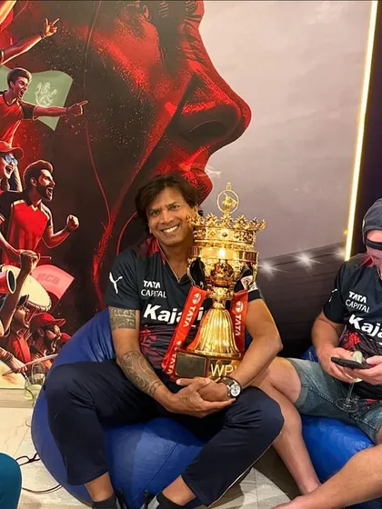 Relaxing with the WPL trophy in the team lounge. These are the quiet moments of reflection after the chaos of the final, where the achievement truly sinks in.