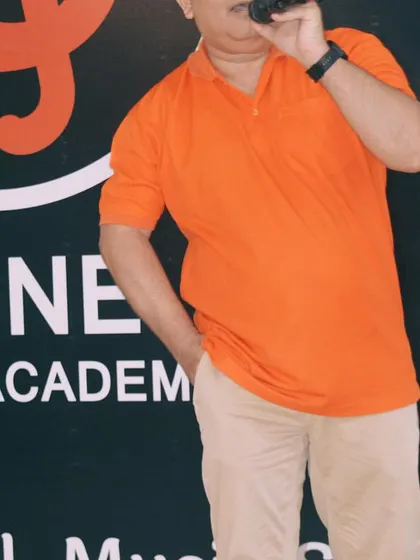 An instructor leading by example, demonstrating vocal techniques to the students during a class.