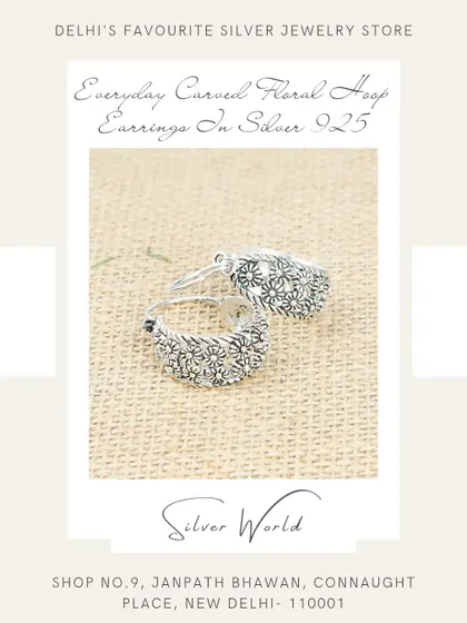 These everyday hoop earrings feature a beautifully carved floral pattern, adding a touch of subtle detail to a classic shape.