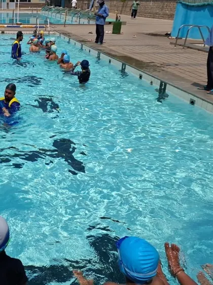 A group of children learning basic swimming techniques under the careful supervision of our coaches.
