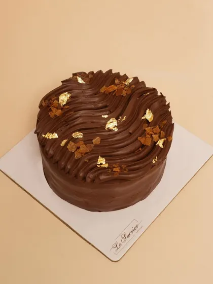 My Belgian Chocolate Crunch Cake, featuring soft chocolate sponge, rich ganache, and a crunchy layer of Callebaut feuilletine for added texture.