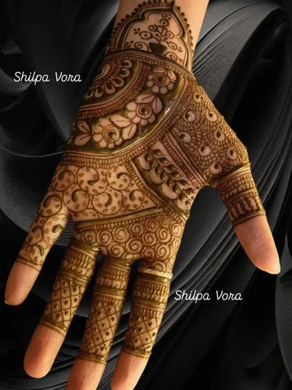 A simple palm design, perfect for a guest who wants a touch of henna.
