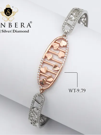 A romantic two-tone bracelet with a charm filled with tiny rose gold hearts. At 9.79 grams, this piece lets your wrist sparkle with the beauty of silver and love.