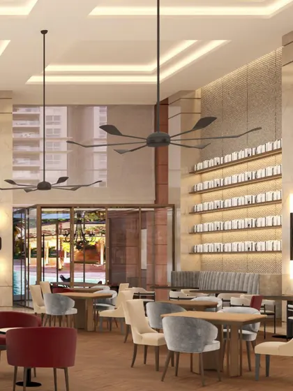 A digital render of the Elevate Clubhouse dining area, showcasing the intended ambiance with its double-height space, large fans, and sophisticated material palette before construction.