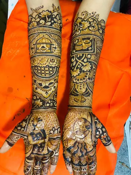 A unique design blending portraits of a couple on the palms with symbols of their faith, including a depiction of a temple and other religious motifs.