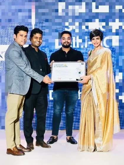 Receiving the award, surrounded by peers and mentors. My practice is built on a foundation of continuous learning and dedication to my craft.