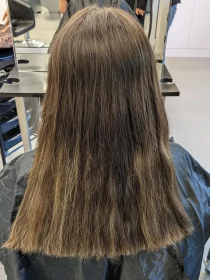 Here is the before photo for a stunning hair transformation. The client started with a simple, one-dimensional color, ready for a rich and captivating new look.