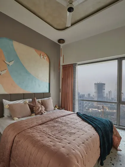 A soft color palette brings charm to this elegant daughter's bedroom. The custom-designed bed back wall features expertly applied textured paint that harmonizes with the terrazzo flooring.