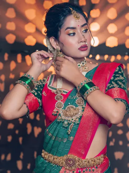 Adding a little Diwali sparkle to the eyes. This festive look features a pop of gold on the eyelids and a deep, rich lip color, perfect for any grand celebration.