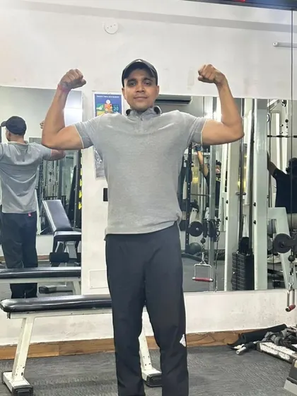 Standing double bicep pose.