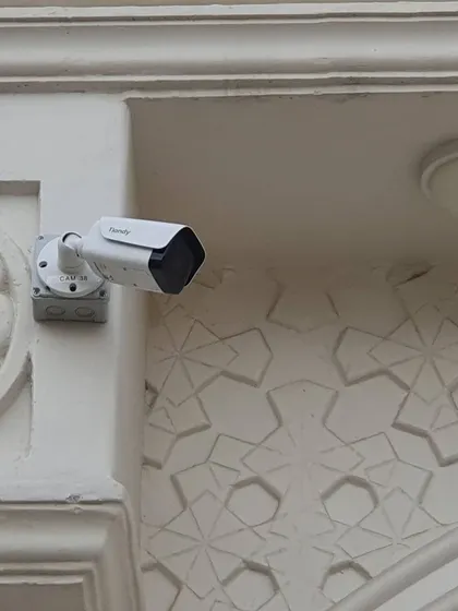 A clean installation of a Tiandy bullet camera on an ornate building facade. I use a junction box to hide the cables and create a neat finish.