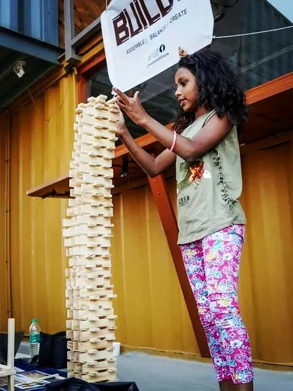 There is no limit to what a child can imagine and build. This young creator is demonstrating incredible patience and understanding of structural integrity to build this towering structure. It’s a testament to how children can grasp complex engineering principles through intuitive play.