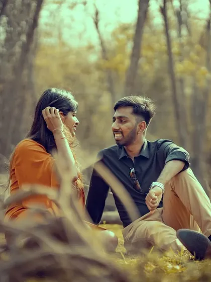 A candid conversation in the woods. Our pre-wedding photography aims to capture the natural dialogue and connection between you.