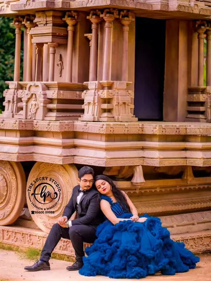 A romantic couple rests against the Hampi stone chariot replica, a unique and iconic backdrop.