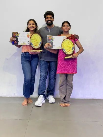 A picture with me and our two competition winners. Seeing my students succeed is the greatest reward.
