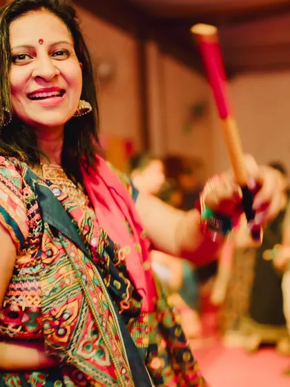 A candid shot from a Garba night, feeling the rhythm with my dandiya sticks. The energy of Navratri is truly special, and I love being a part of it.