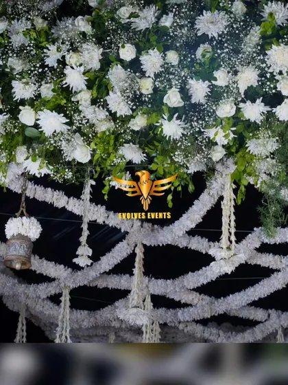 Another angle of the bell mantap, highlighting the combination of white florals and traditional elements.